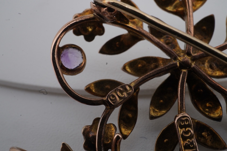An Edwardian seed pearl and amethyst pendant, early 20th century, of floral design, set with seed pearls and circular-cut amethysts, mounted in gold, length 4cm including bail, brooch fitting, stamped 9ct and H&GB, Condi